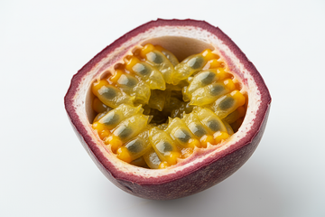 purple skinned passion fruit cut in half with the inside showing